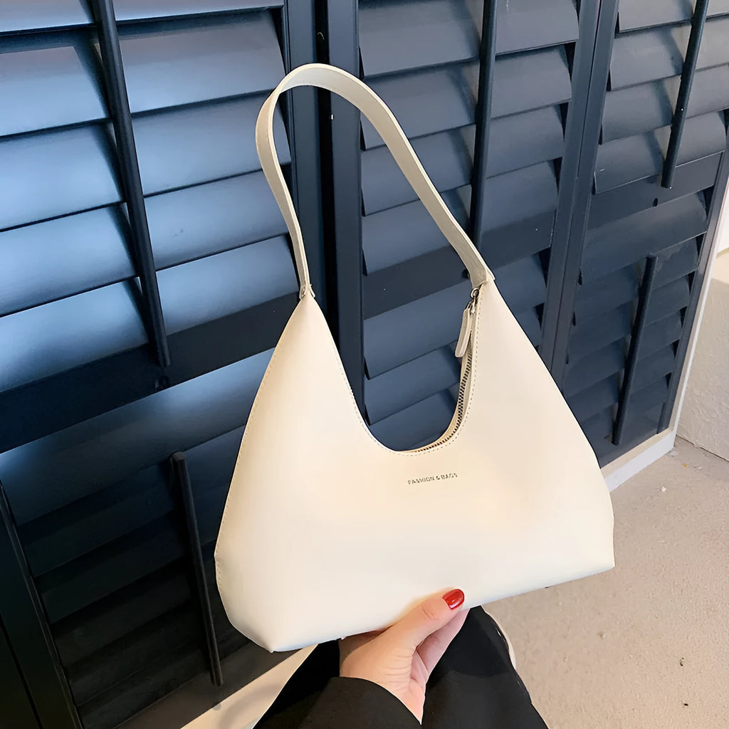 Women's retro style PU shoulder handbag in pillow shape with organised interior compartments