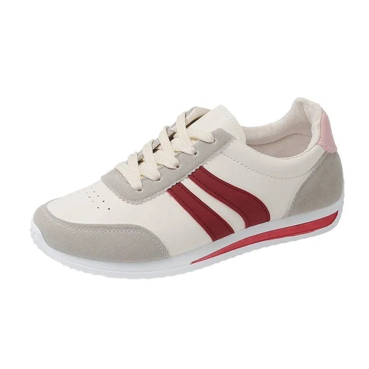 Blue and red lace-up low-top sneakers with a round toe and soft rubber sole.