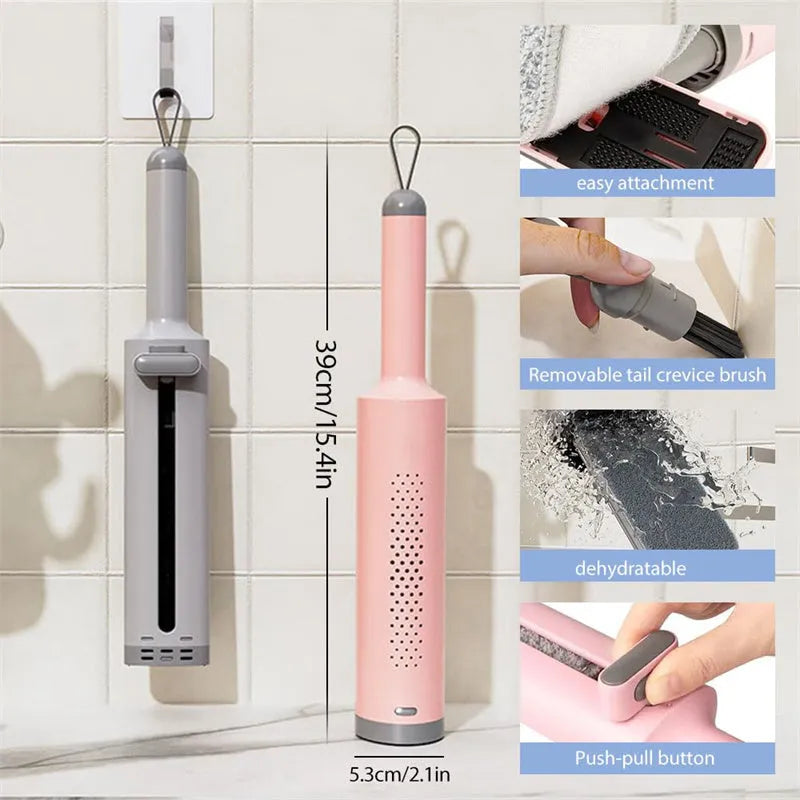 Rotatable self-squeeze mini mop with pink handle, crevice brush, and two microfiber pads on a tiled floor