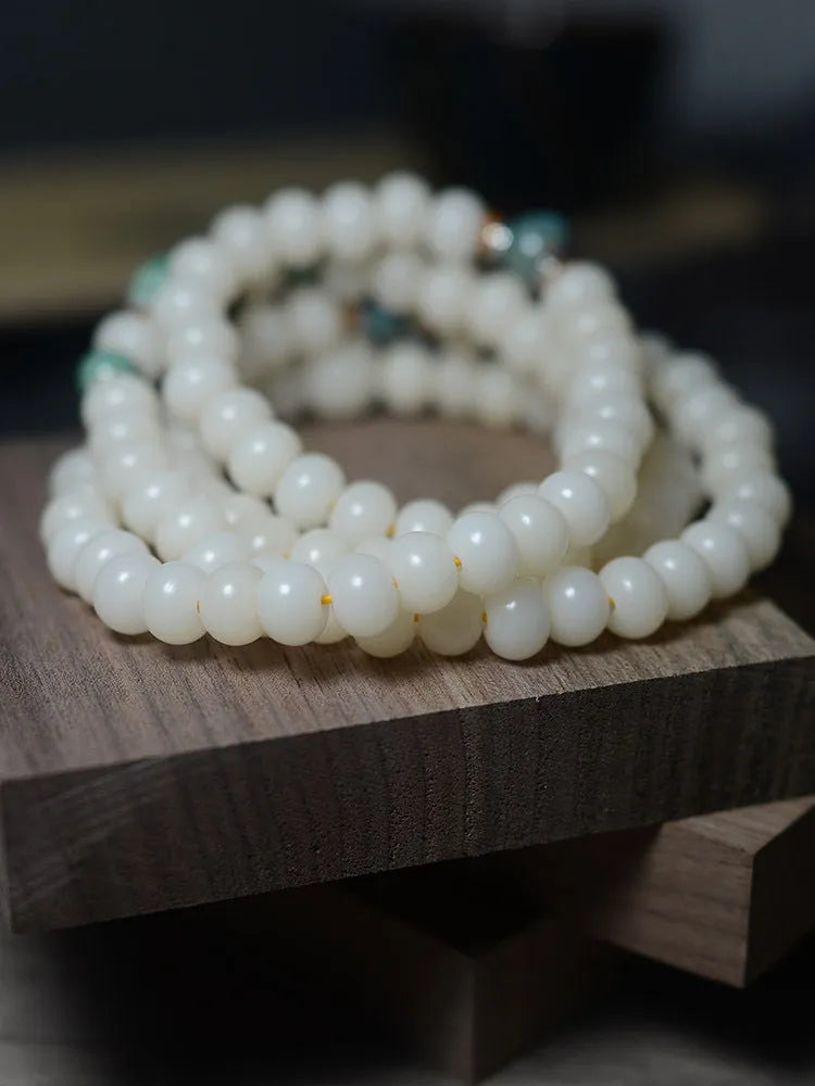 White jade bodhi seed bracelet with 108 flat round beads in 7x9mm and 8x10mm sizes