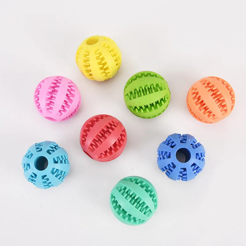 Small pink rubber pet dog toy self-hi relieving stuffy molars chew toy 5cm diameter on white background