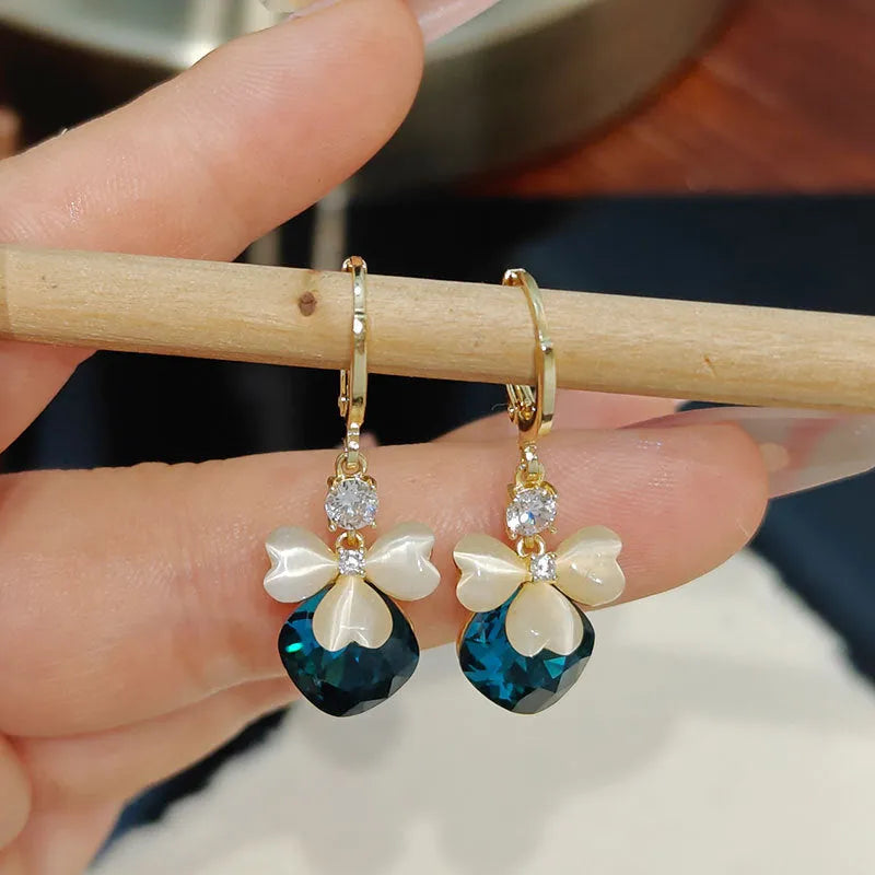 Electroplated blue crystal earrings with bow shape on alloy base