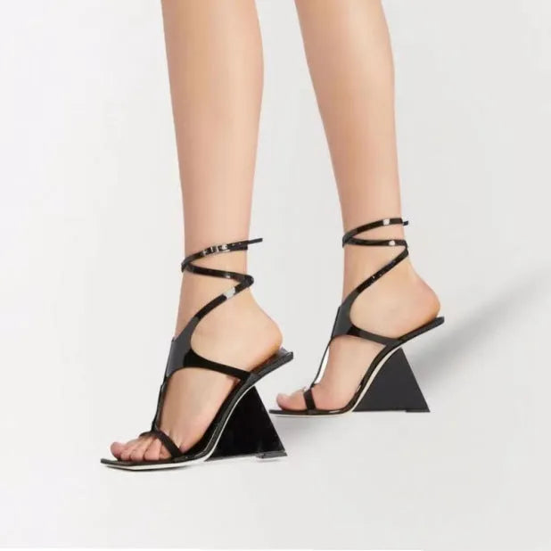 Women's black high heel sandals with 9.5cm heel, square toe, and button fastening.