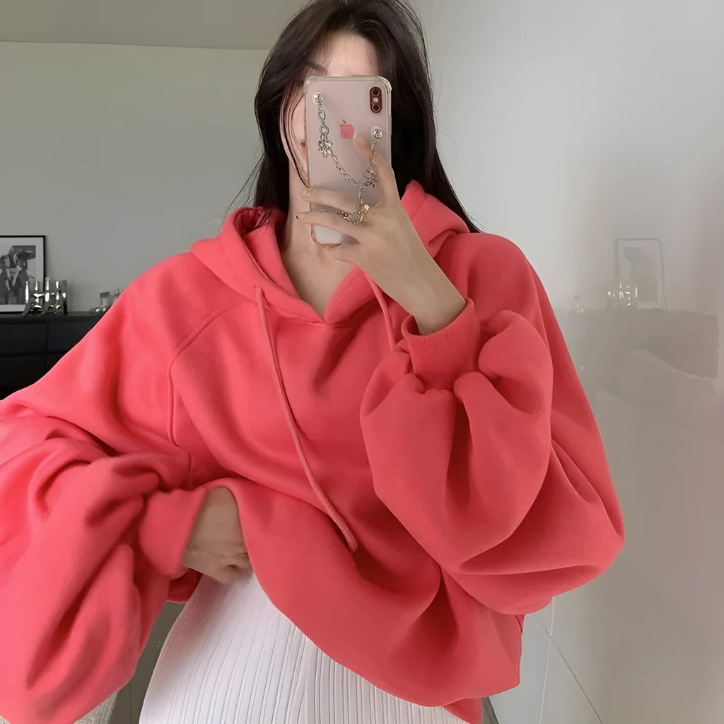 Watermelon red mulberry silk sleeveless hooded sweater on hanger showing loose fit and hood detail