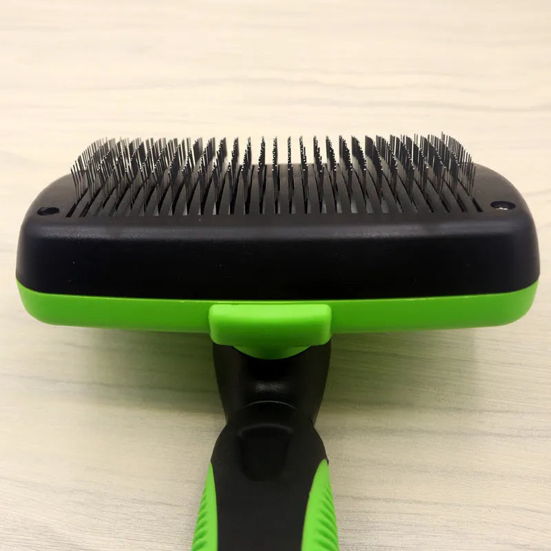 Cat and dog grooming needle comb with stainless steel teeth and dark green ABS TPR handle on white background