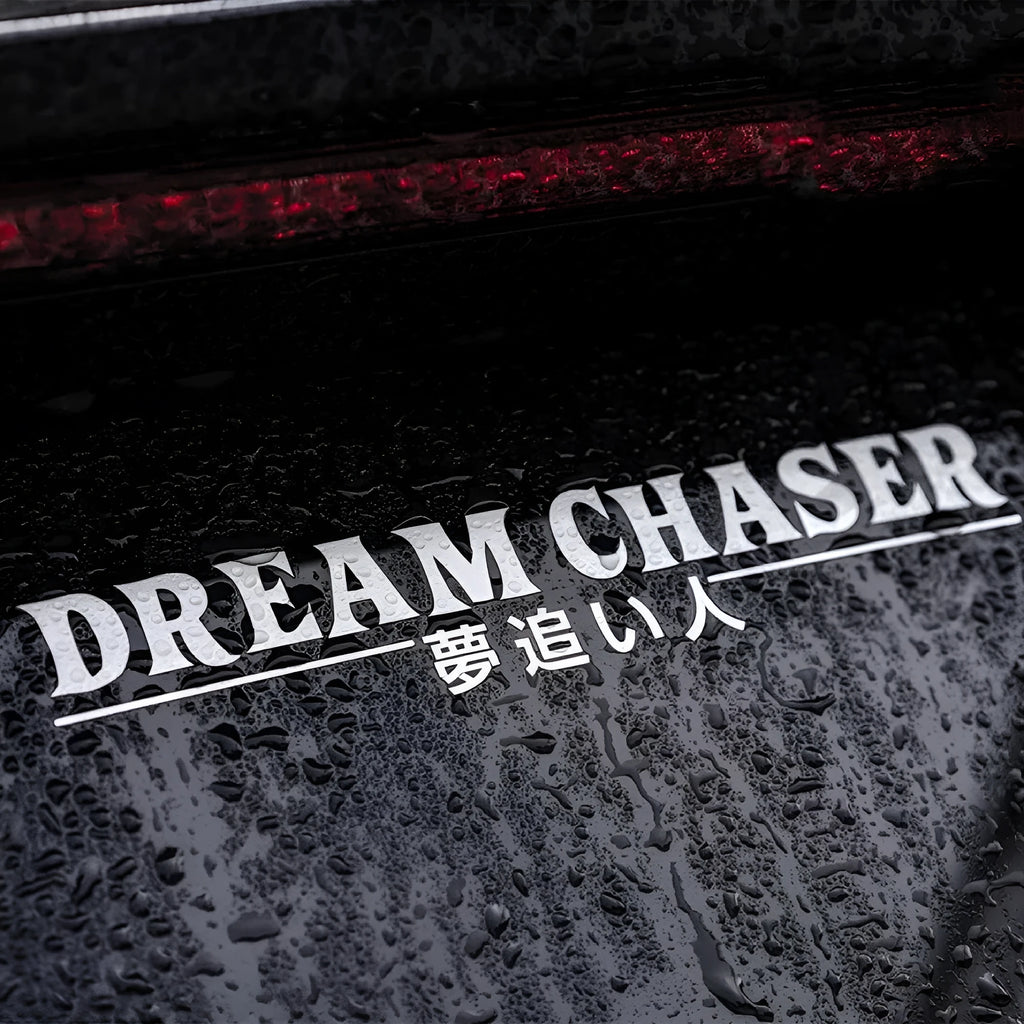 A 40cm long by 7cm wide black Chinese character car decal for a vehicle rear window.