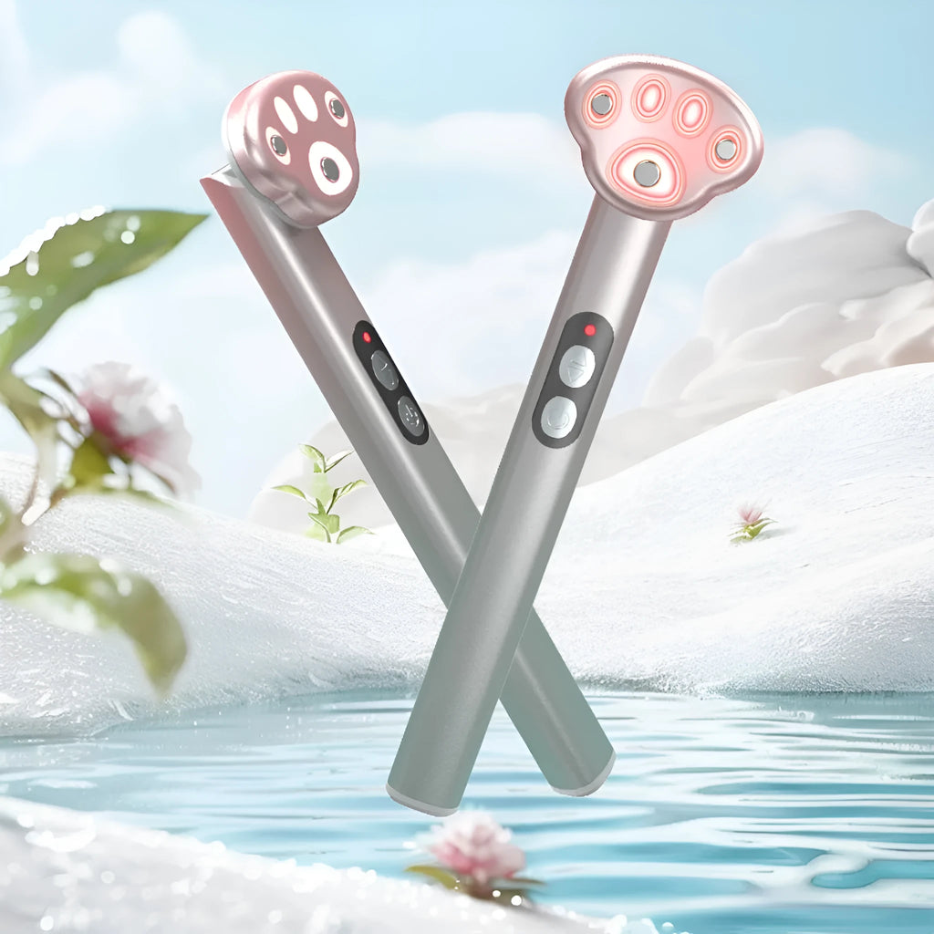 Pink gradient cat's paw shaped eye massager with micro-current vibration and colour light therapy.