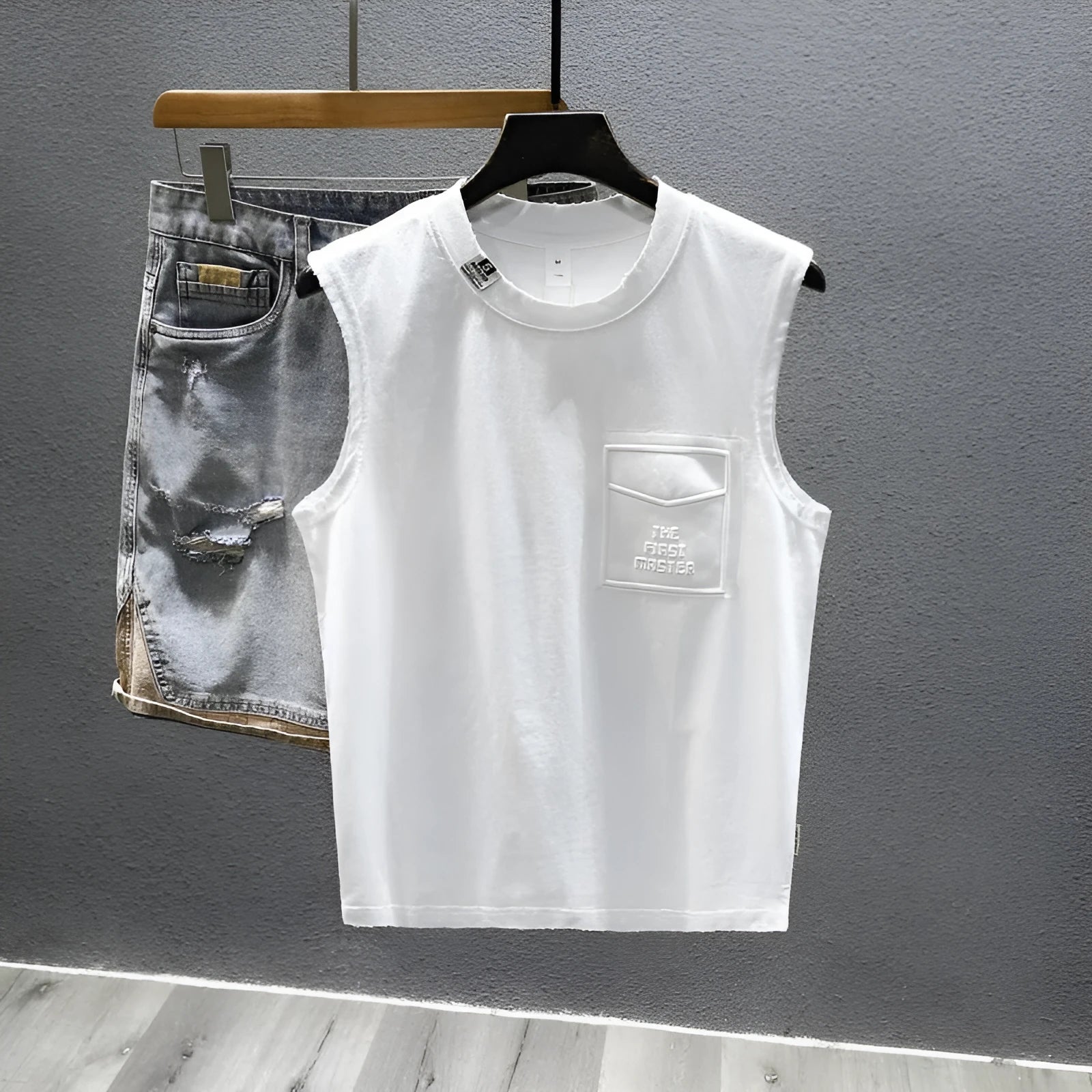 Cotton sleeveless fitness t-shirt in solid black colour showing loose fit and straight hem design