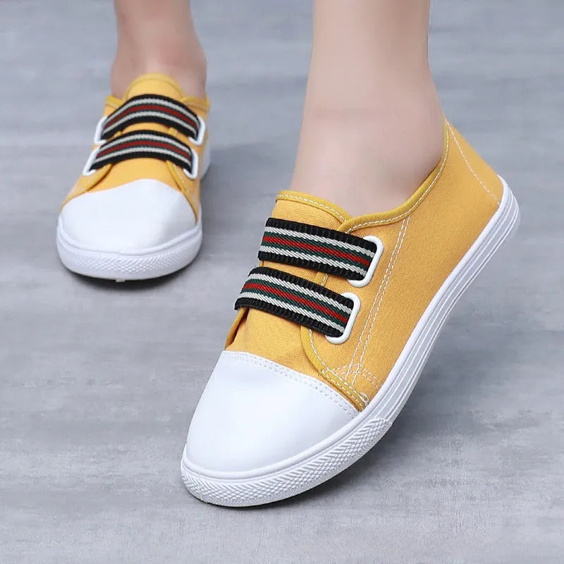 Breathable non-slip slip-on canvas sneakers with flat heel and round toe in black, white, or yellow