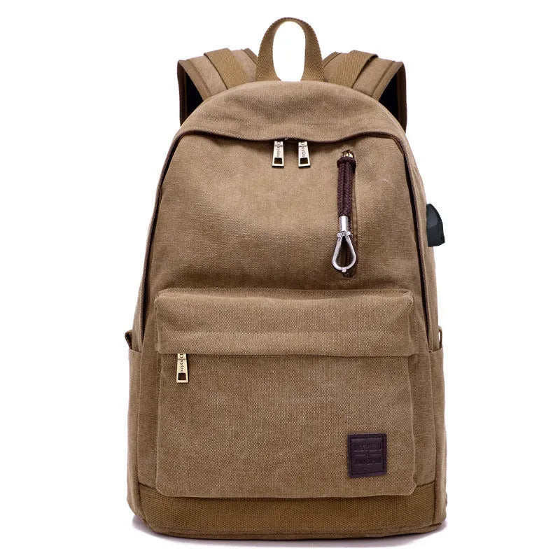 Canvas backpack with USB charging port showing laptop compartment and multiple pockets in grey colour