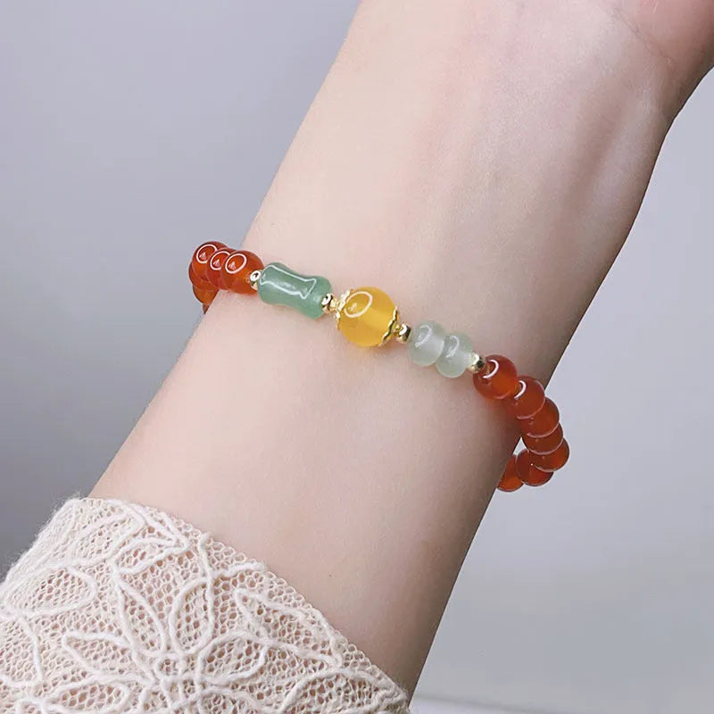 Handmade red agate bracelet with Chinese dragon design for women.