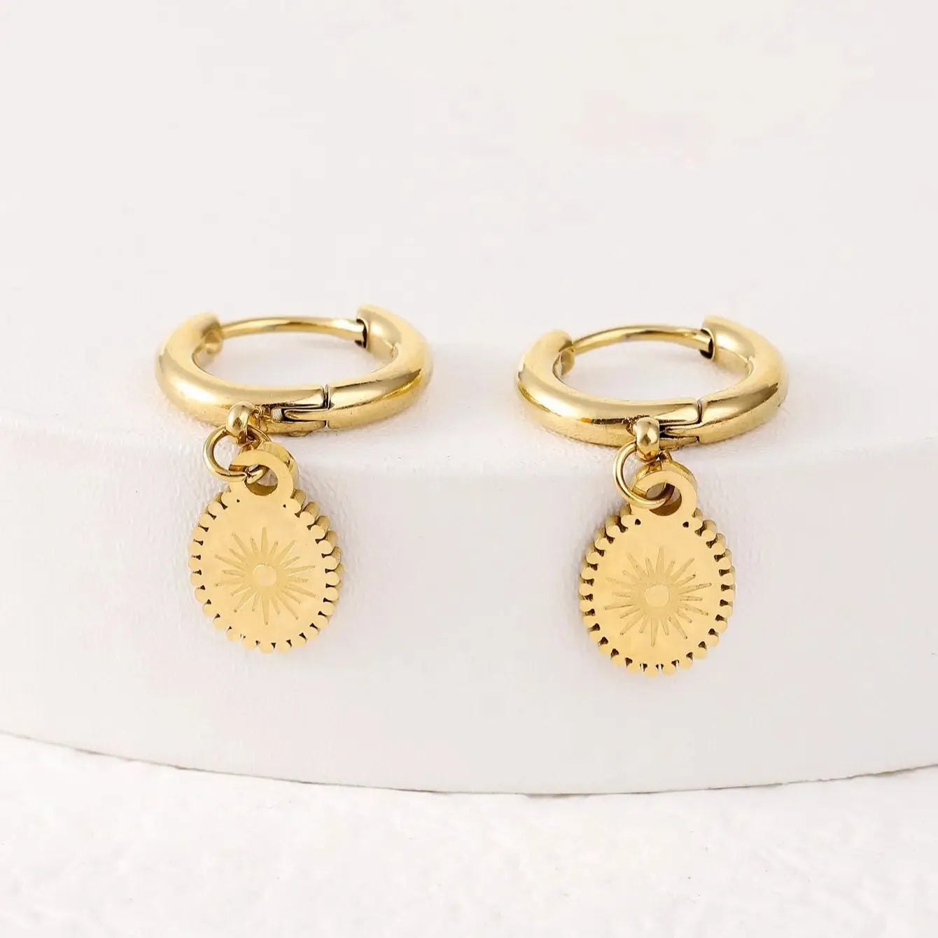 Silver geometric ellipse stud earrings for women made from stainless steel.