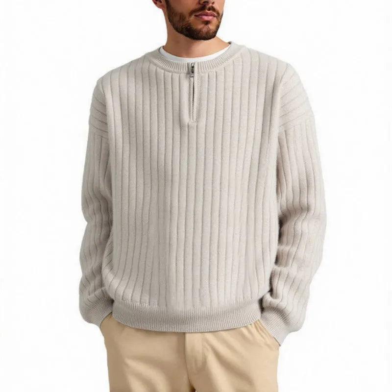 Men's grey half-zip textured knit sweater showing loose fit and long sleeve design