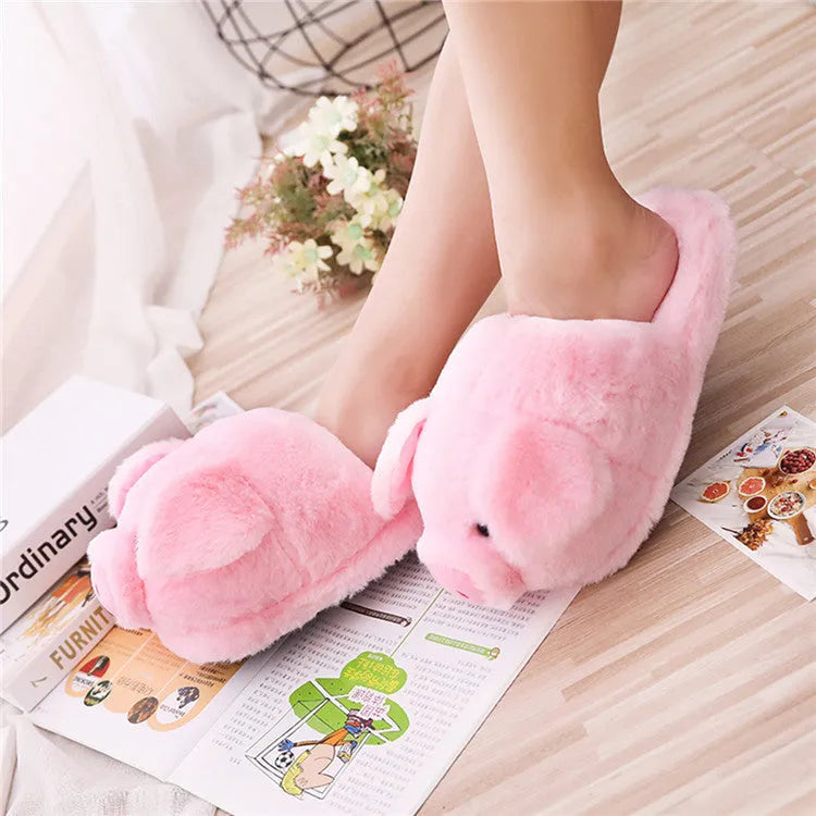 Pink pig-shaped floor slippers made from short plush fabric.