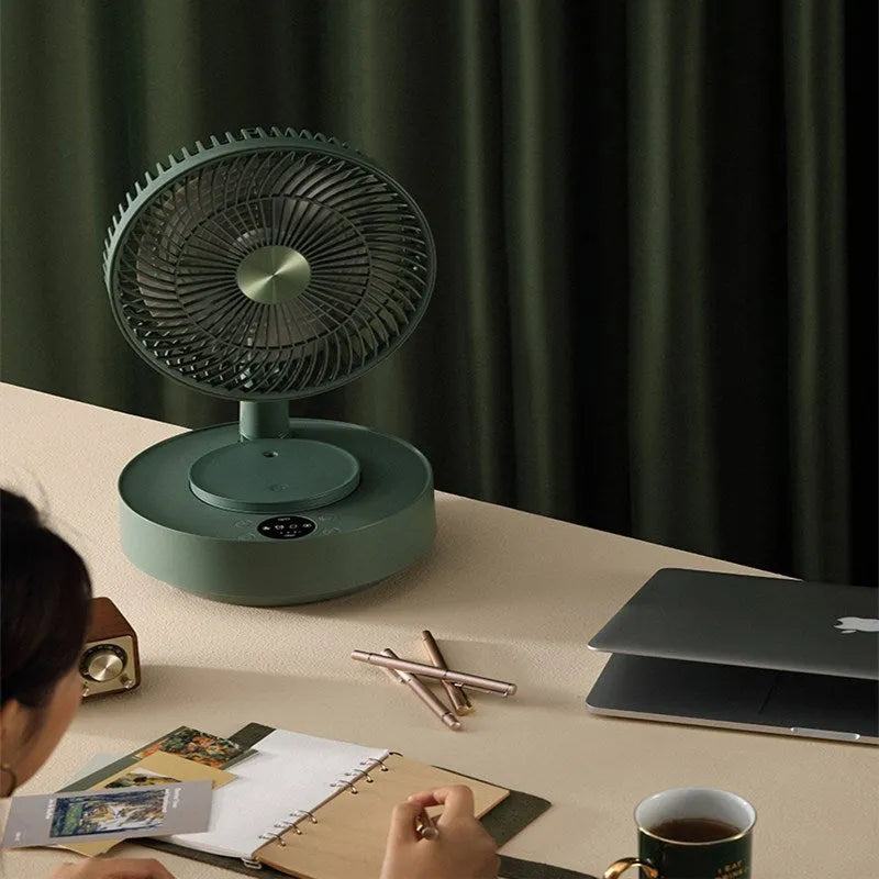 Green telescopic floor-standing electric fan with remote control in extended position