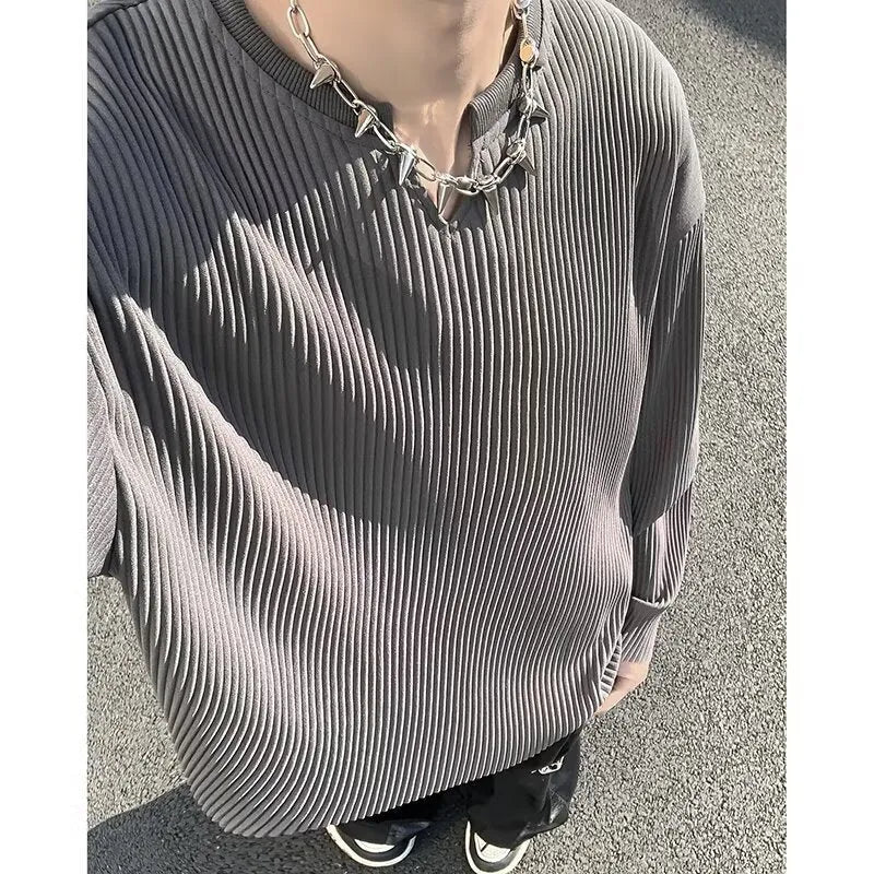 Plus size striped pullover top in black with long sleeves and loose fit