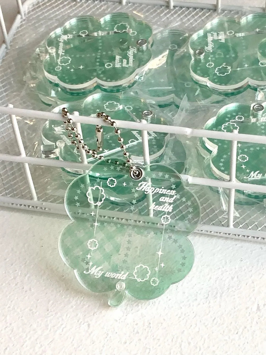 Acrylic four-leaf clover mobile phone pendant charm in blue, green, or mint colour options