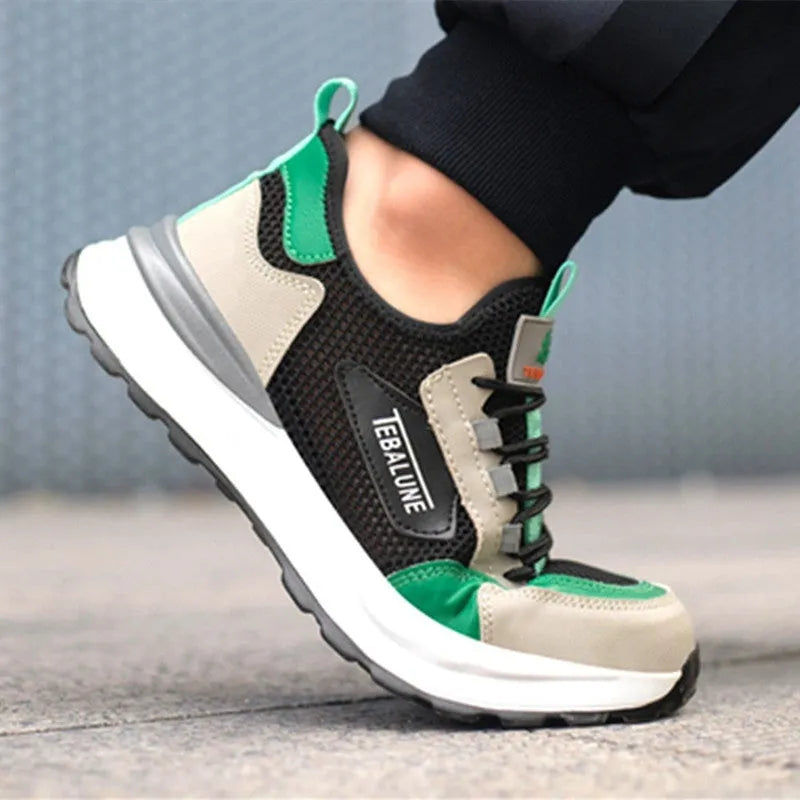 Black and green low-top safety shoes with a mesh upper and plastic steel toe cap on a white background.