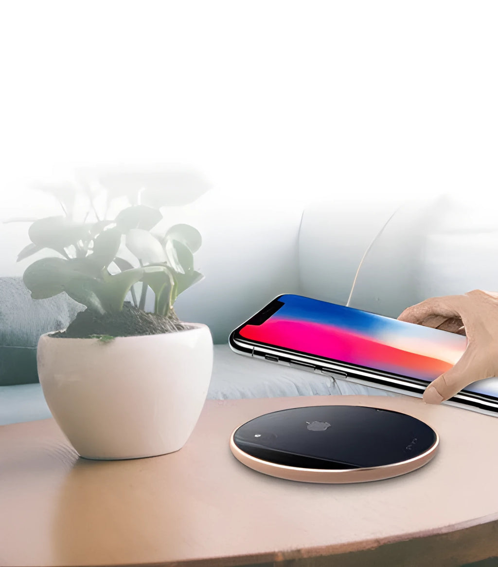 Ultra-thin aluminium wireless charging pad in silver on a wooden table