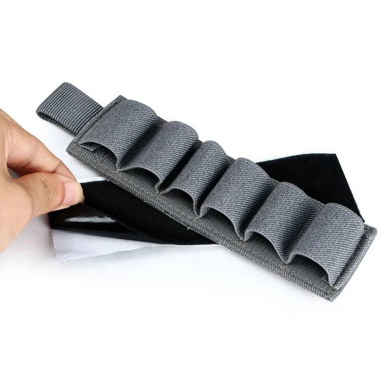 Tactical 6-hole storage sticker made of 1000D nylon in army green, showing six slots for tools.