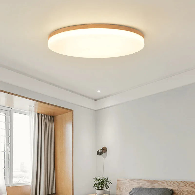 Japanese minimalist ceiling lamp with wood art body and acrylic shade in three available sizes.