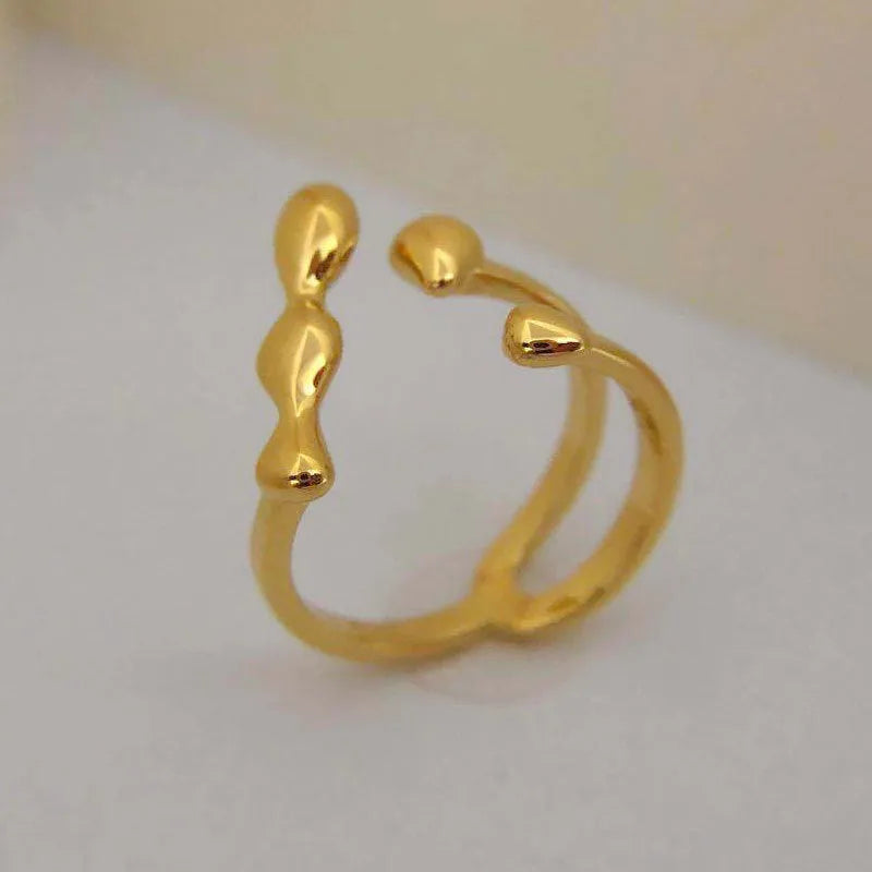 Brass opening ring with spherical design in gold or silver colour for women