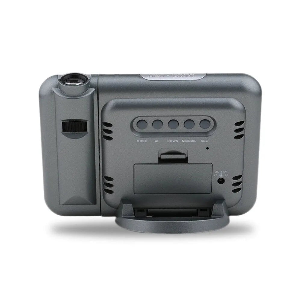 Black digital projection alarm clock with LED display showing time, temperature, and humidity.