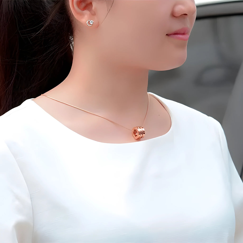 Screwdriver pendant necklace in titanium steel with 18K gold plating, shown in gold, rose gold, and steel colour at 45cm or 50cm.