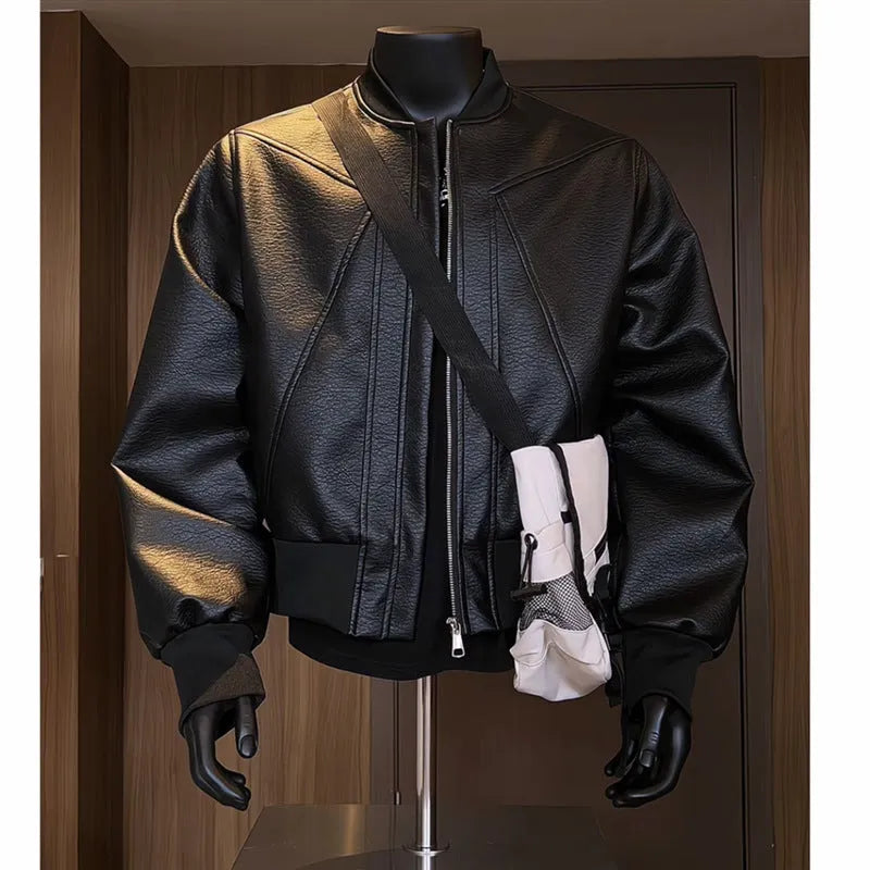Men's black slim-fit PU leather jacket with extended length and litchi grain texture.
