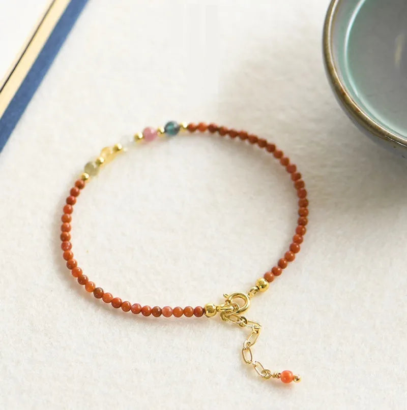 Women's adjustable freshwater pearl bracelet with crystal shapes on amethyst braided rope