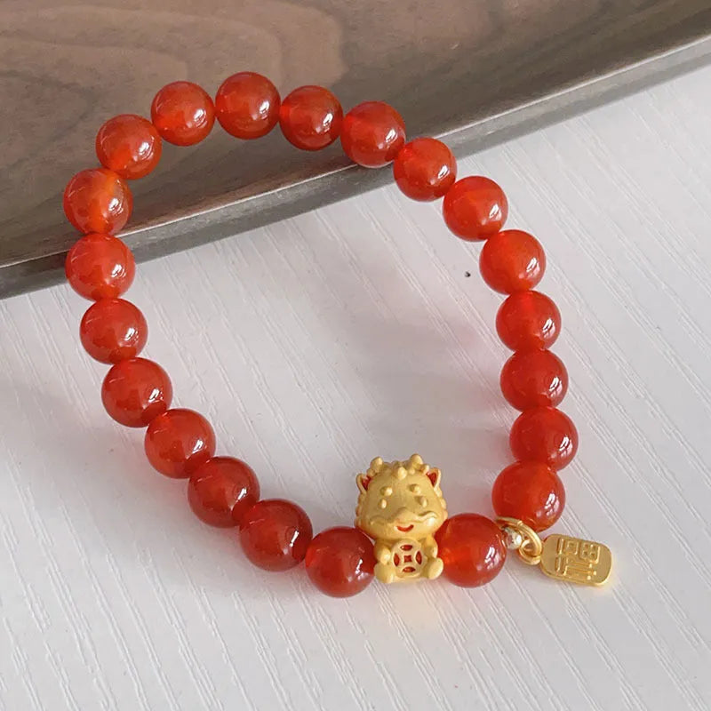 Handmade red agate bracelet with Chinese dragon design for women.