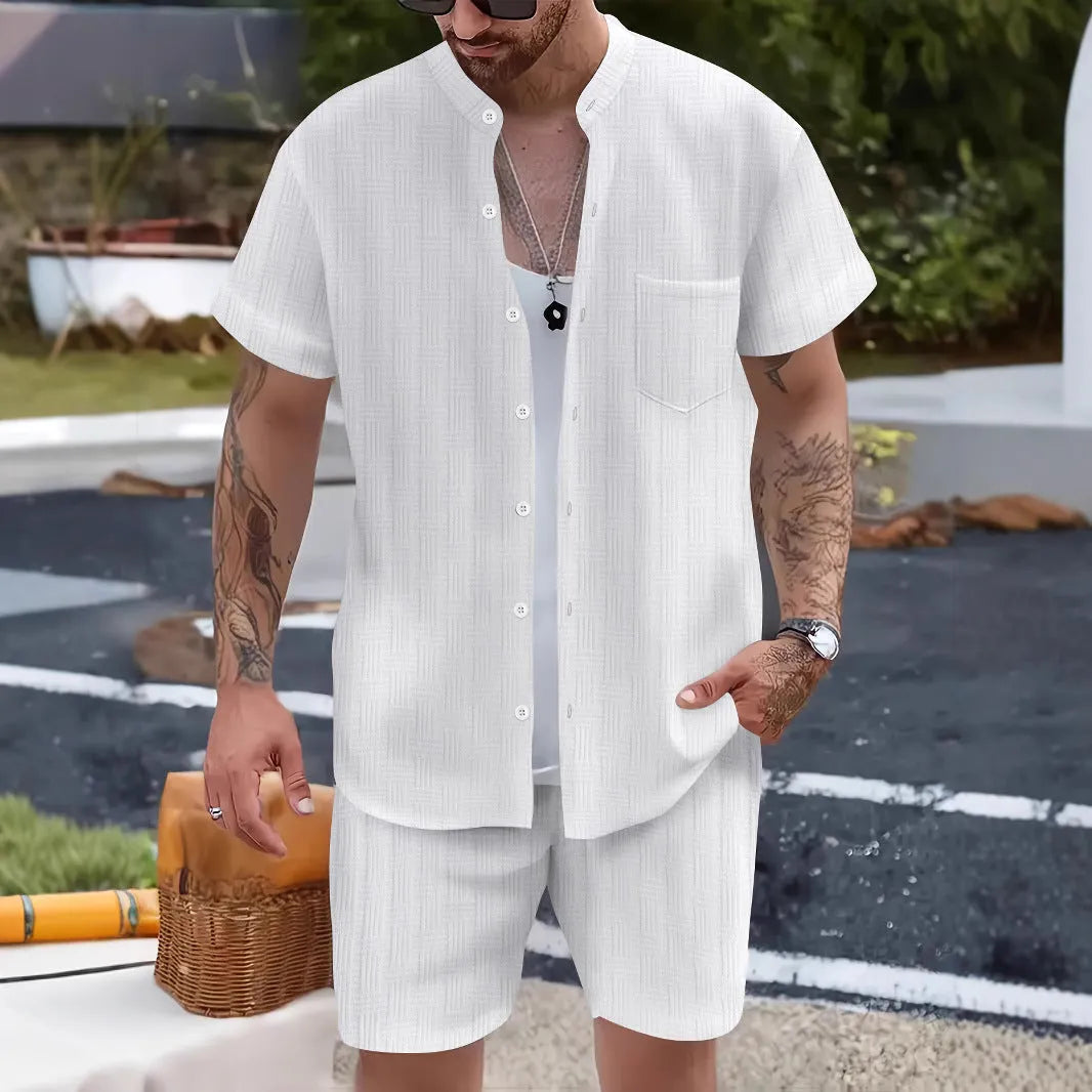 Men's Henry collar short sleeve shirt and shorts set in apricot placed on flat surface