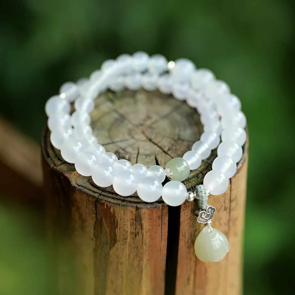 S925 silver bracelet with white agate and Hetian jade stones showing lotus geometric design