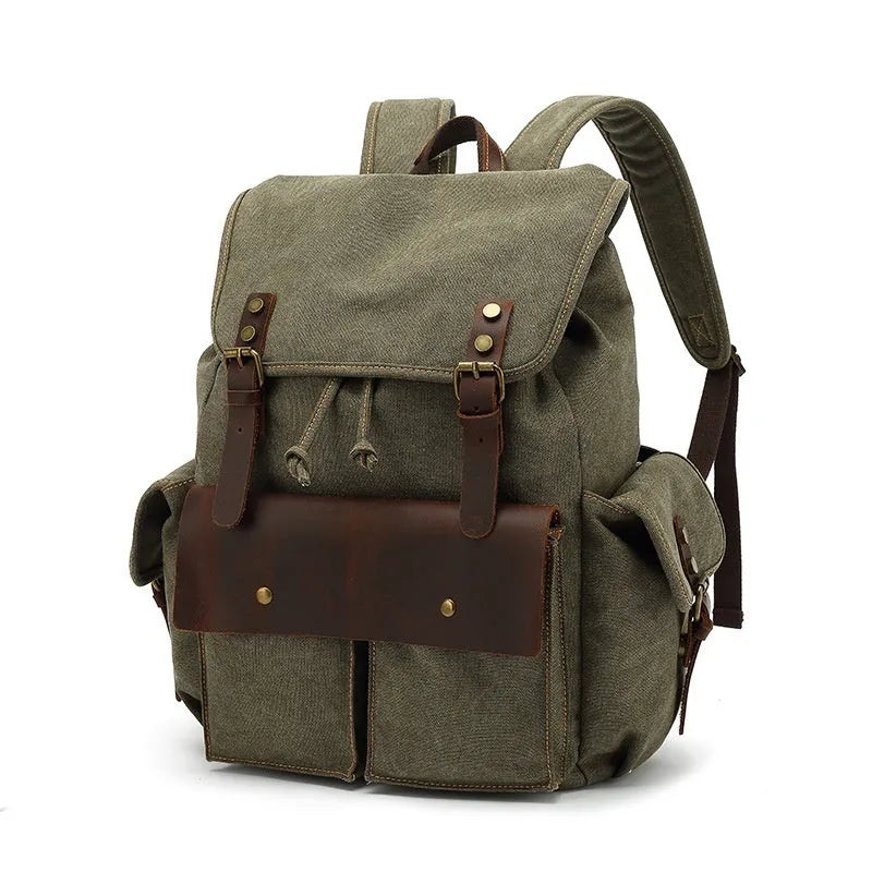 Retro military green canvas backpack with antique bronze hardware on a plain background.