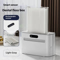 Intelligent Induction Dental Floss Box in dark gray, light gray, and gold colour options.