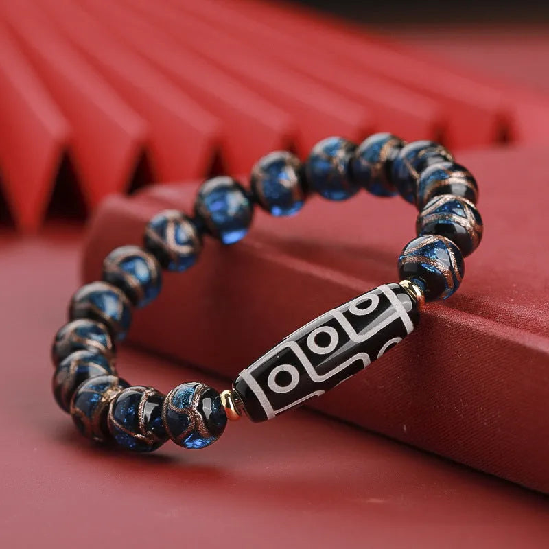 Close-up of a Chinese style coloured glaze bead bracelet with auspicious patterns, showing bead sizing options.