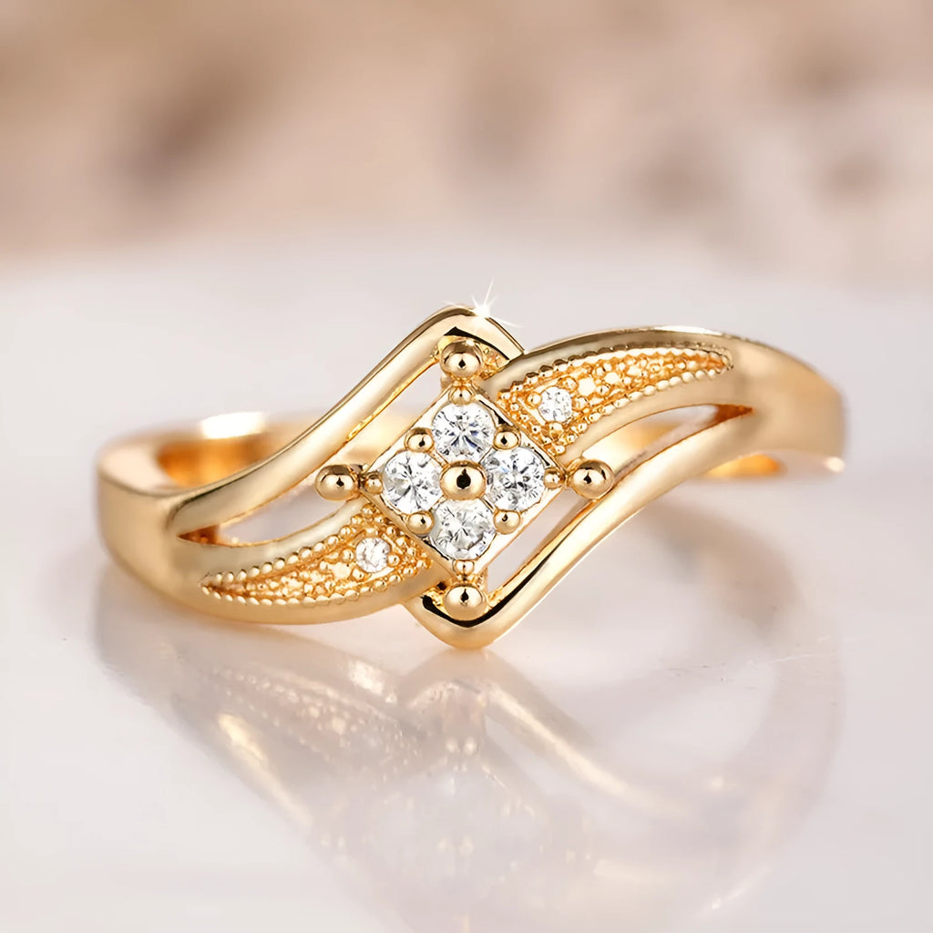 Yellow gold coloured copper diamond ring with geometric design and micro inlaid zircon detail.