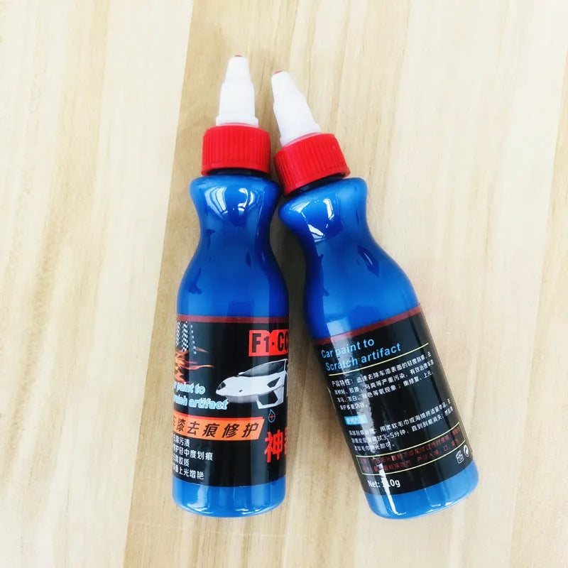 Small blue car wiping tool with scratch repair agent bottle for automotive paintwork touch-up applications
