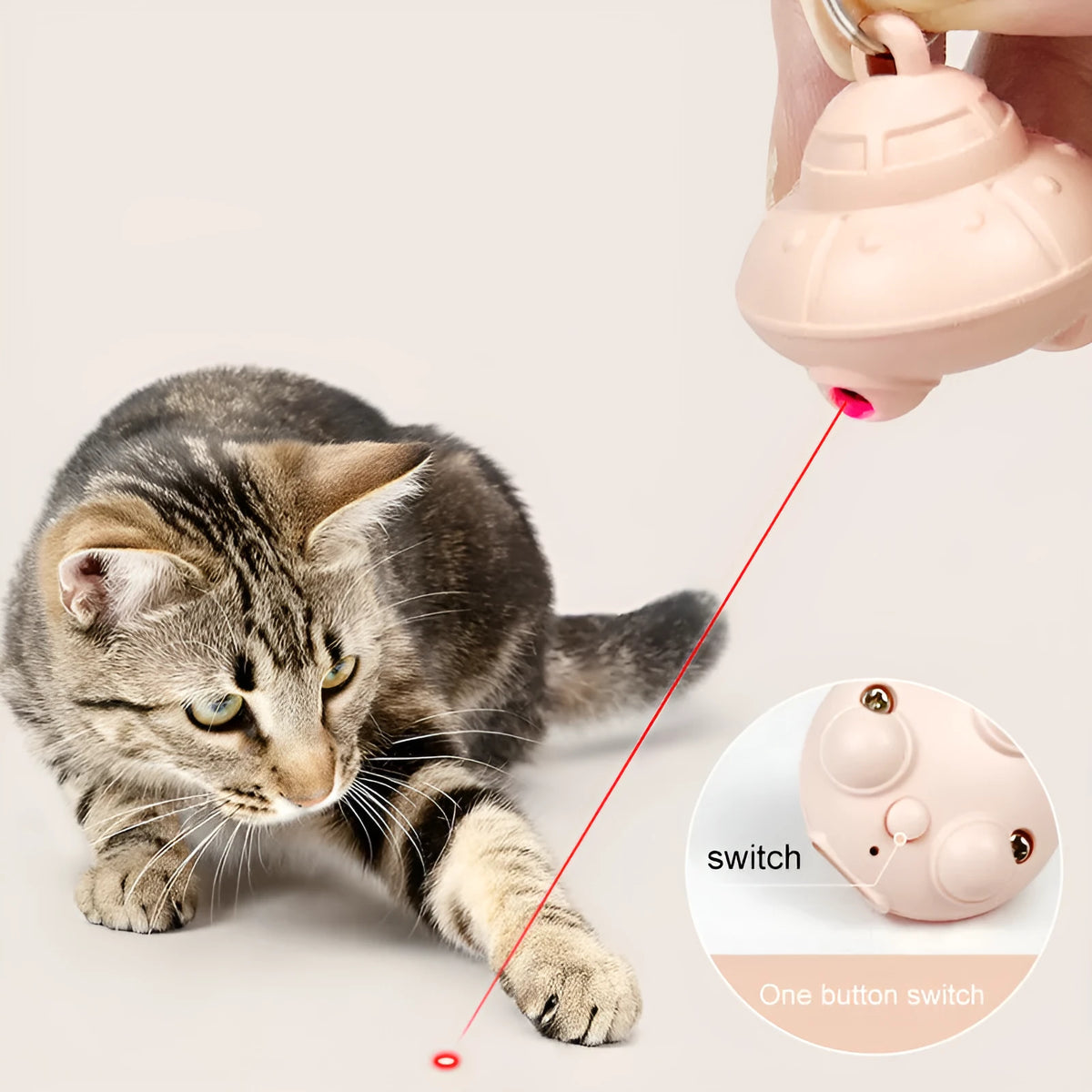 Green cat collar laser toy with USB charging and 360° rotation on a pink cat collar
