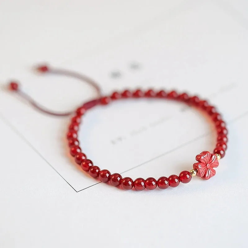 Hand-woven red agate bracelet with ethnic style design and diamond-shaped beads