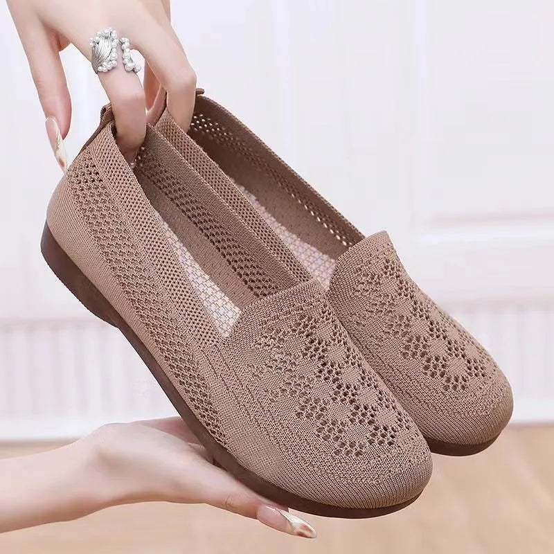 Beige women's low-top casual trainers with breathable Flyknit mesh and a flat antiskid PVC sole.