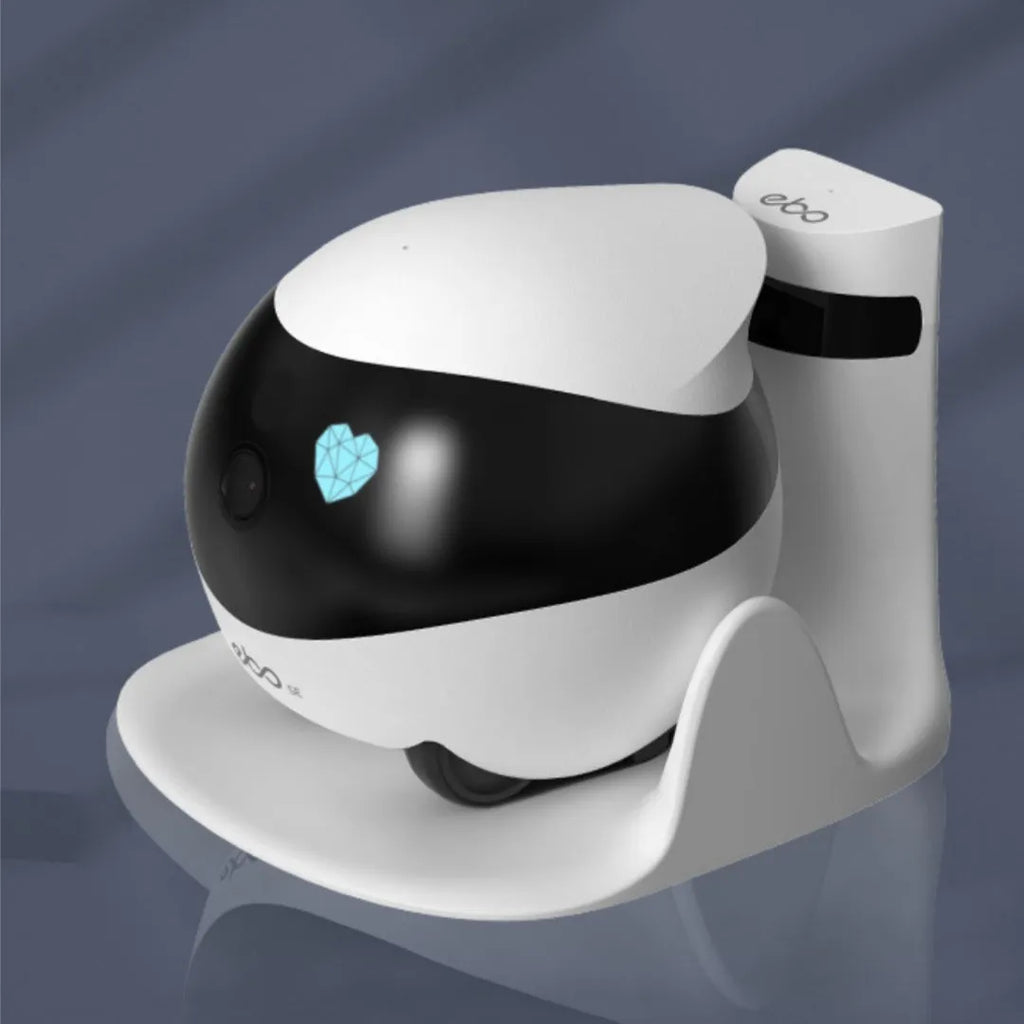 White smart mobile surveillance robot camera with automatic docking station on a floor.