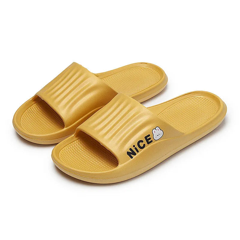 Pair of lightweight EVA flip-flop slippers with a minimalist cartoon pattern and non-slip soles.