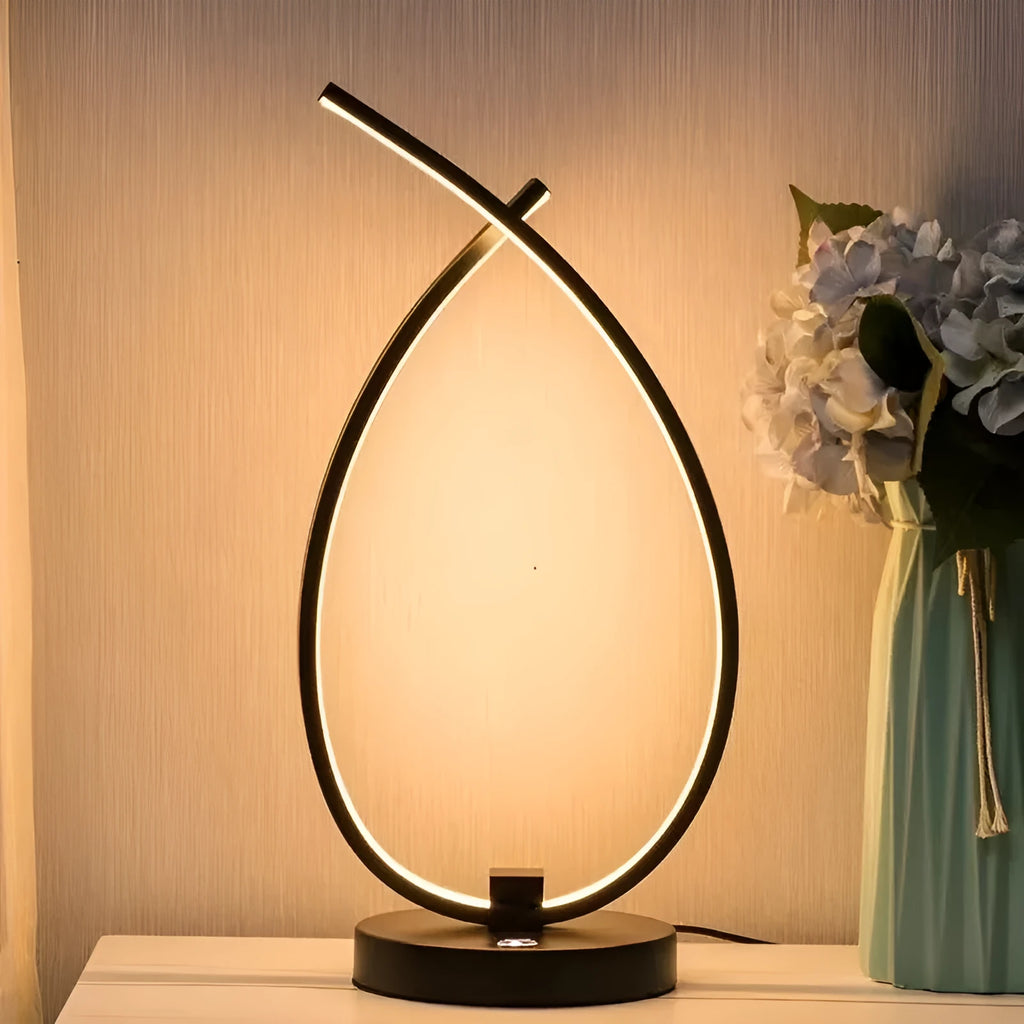 Black and white water drop shaped USB bedside table lamp measuring 30cm tall