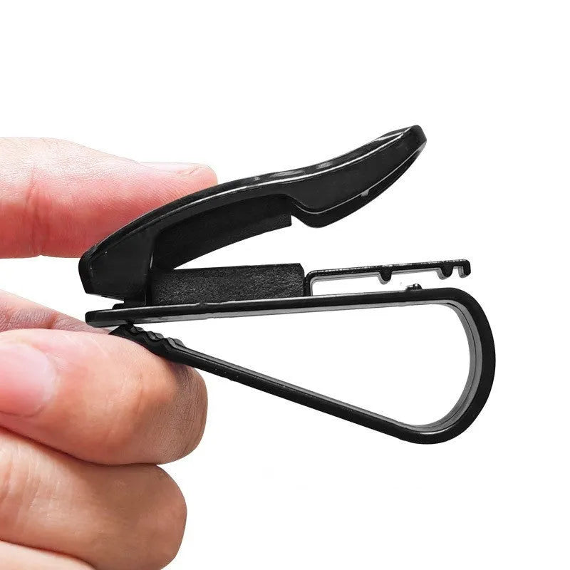 Black plastic car sun visor clip holding sunglasses and cards, measuring 6.5cm by 2.3cm