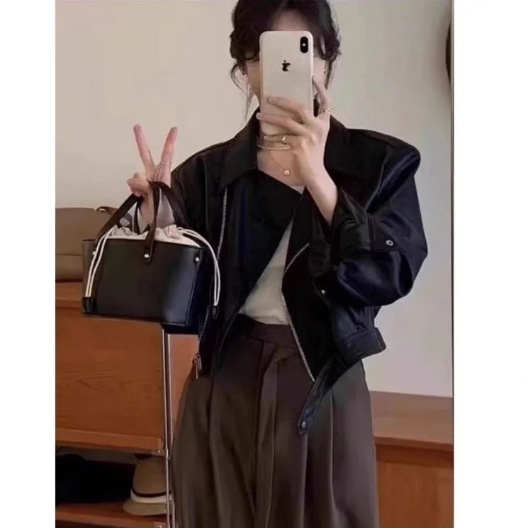 Women's brown retro leather coat jacket with slim fit design and pocket detailing