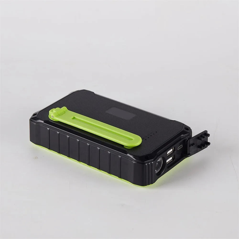 Orange and green hand solar mobile power bank with hand crank and dual USB ports