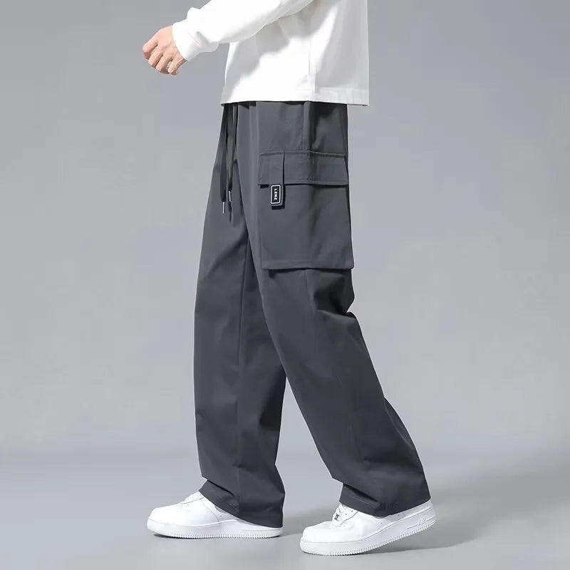 Boys straight leg cargo pants with drawstring waist and large pockets in Army Green