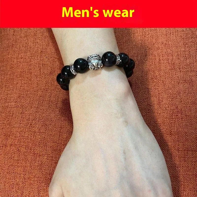 Obsidian and 999 silver beaded bracelet showing Jucai NAFU stone detail in two size options.