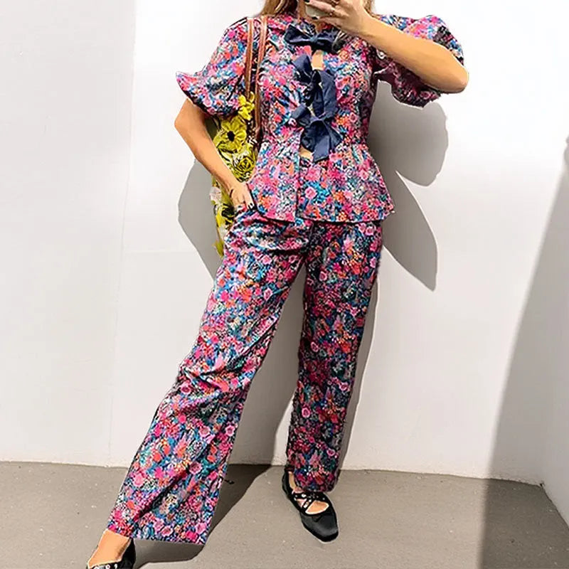 Women's floral print leisure suit set with tie-neck blouse and matching trousers